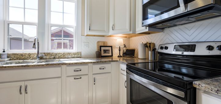 Freshly painted white kitchen cabinets